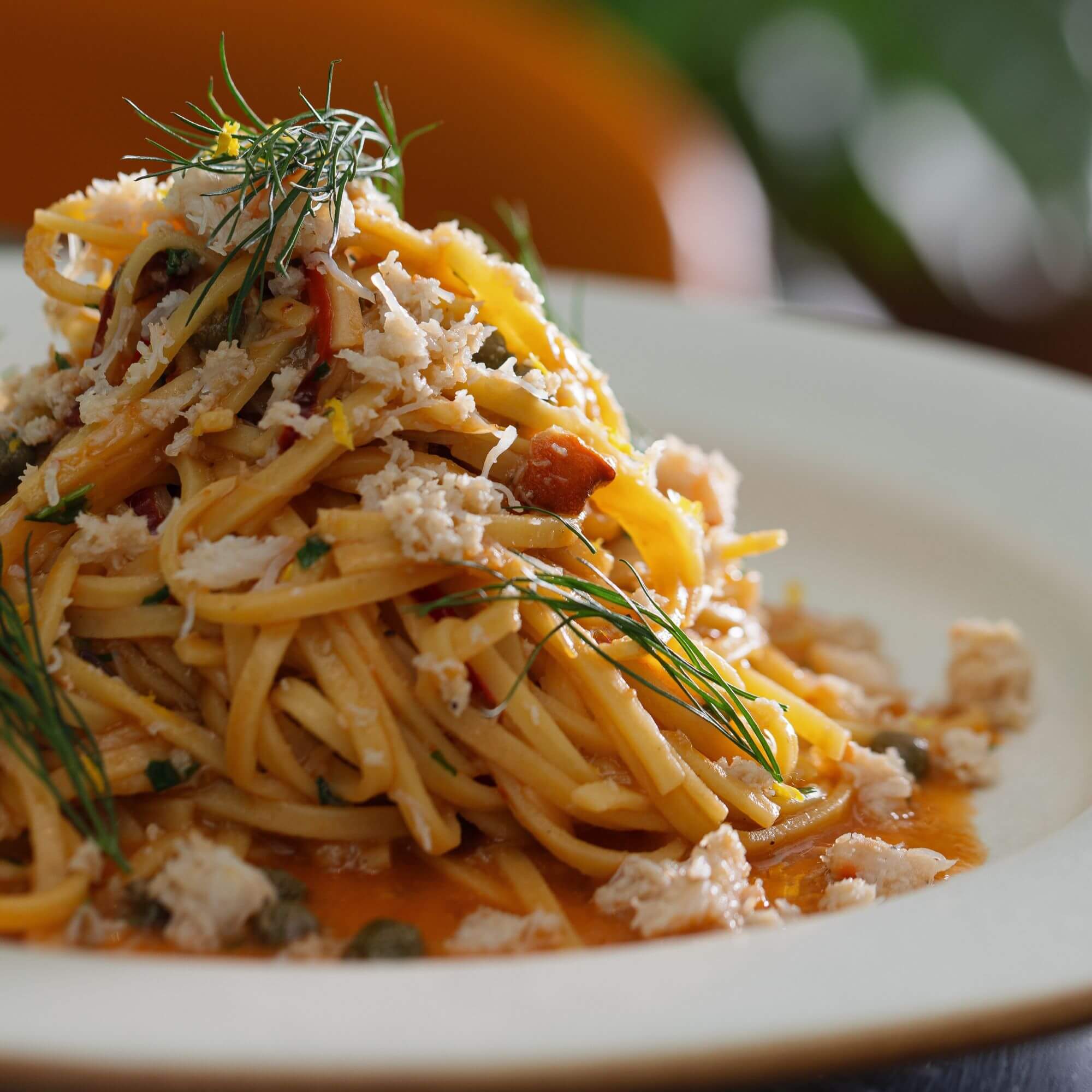 Crab linguine tossed in a light tomato-garlic sauce with capers, fresh dill, lemon zest, and sweet white crab meat at Chequer Lane.